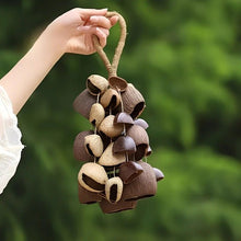 Load image into Gallery viewer, Handmade nutshell wind chime, nutshells rustling in the wind, bringing a touch of mountain forest atmosphere to your home.
