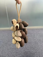 Load image into Gallery viewer, Handmade nutshell wind chime, nutshells rustling in the wind, bringing a touch of mountain forest atmosphere to your home.
